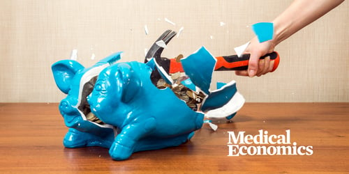Blue piggy bank smashed by hammer