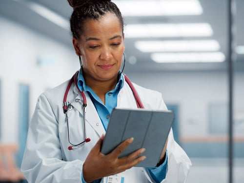 Clinician accessing patient records from tablet device