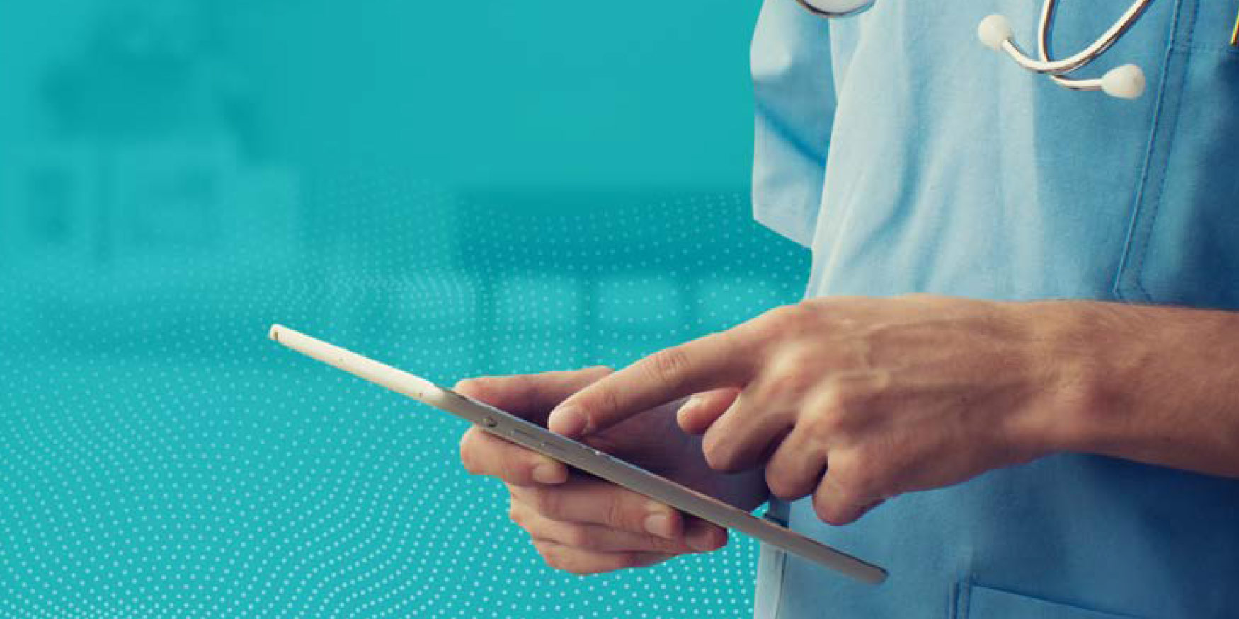 Doctor in scrubs using mobile device