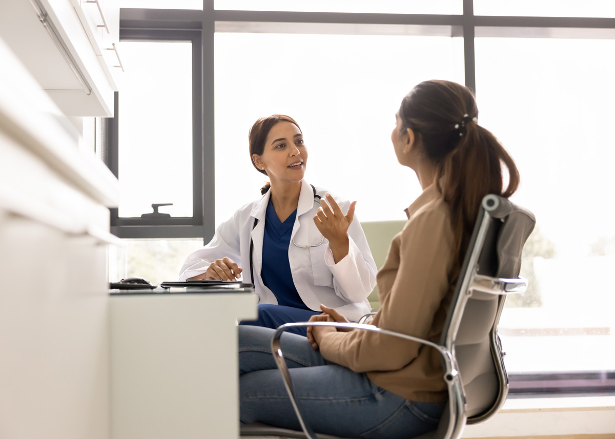 physician discussing medical plan with patient in office