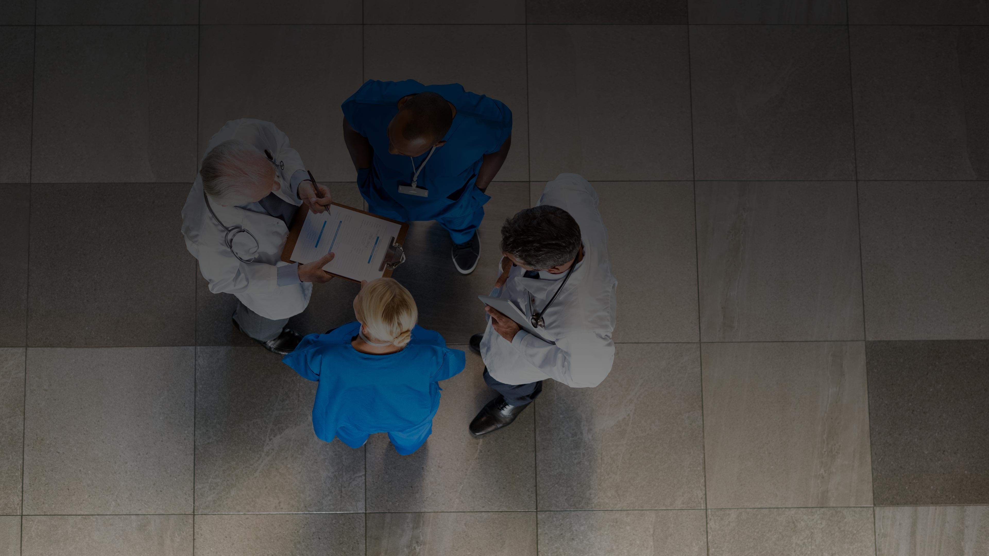 Team of doctors and nurses providing patient care in EHR